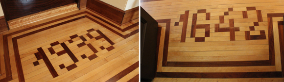 Wooden floor with darker slate forming the numbers 1642.