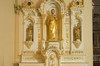 Golden and sculpt Altar of devotion with an altarpiece. At his center, Saint Joseph gilded statue with his left hand touching his heart
