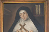 Painted portrait. Mary of the Incarnation with her nun clothes. Turned to the left, closed eyes. Wrist crossed, holding a cross on her heart.